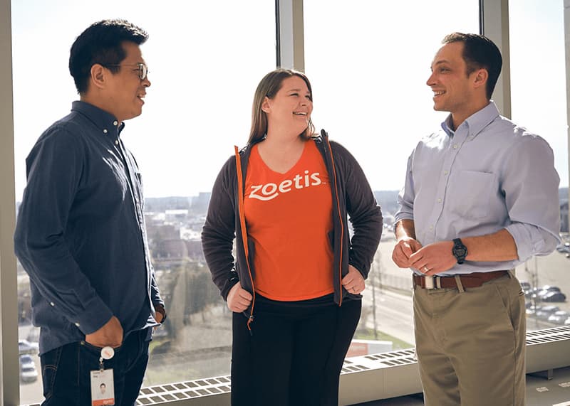 Zoetis colleagues talking in hallway - Zoetis