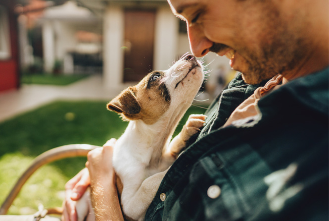 Man holding dog - Zoetis